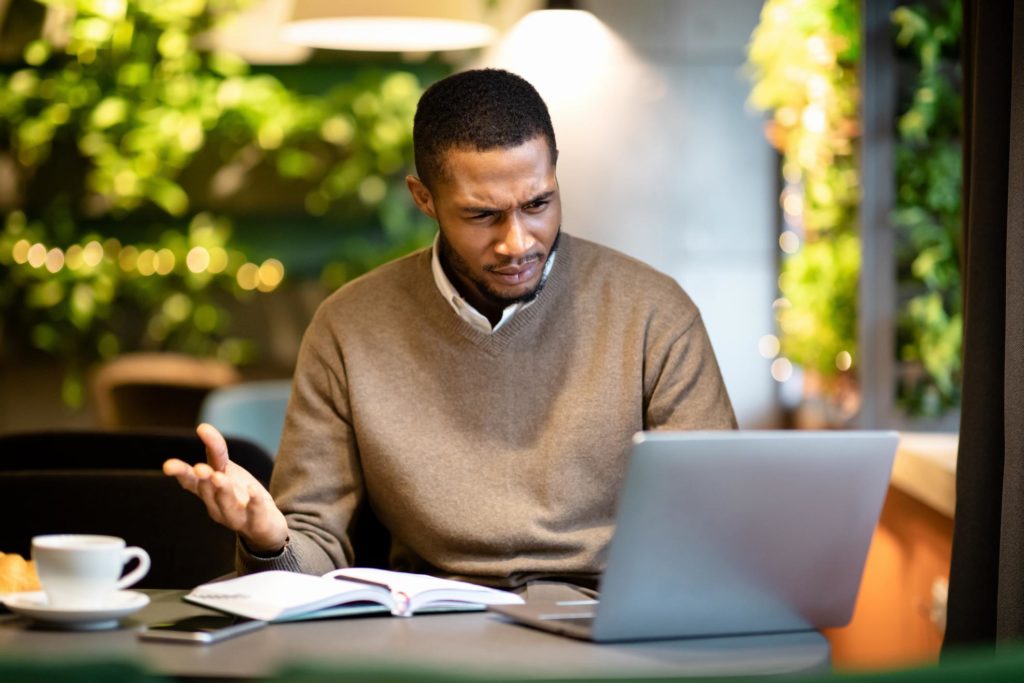 Man confused, stares at computer. Change, while scary, is necessary for growth both personally and professionally. Especially today, the adapt or die mantra is all too real.