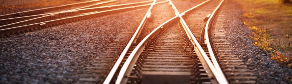 train tracks at dusk representing change management