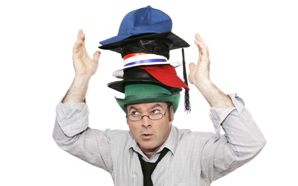 person wearing a lot of hats