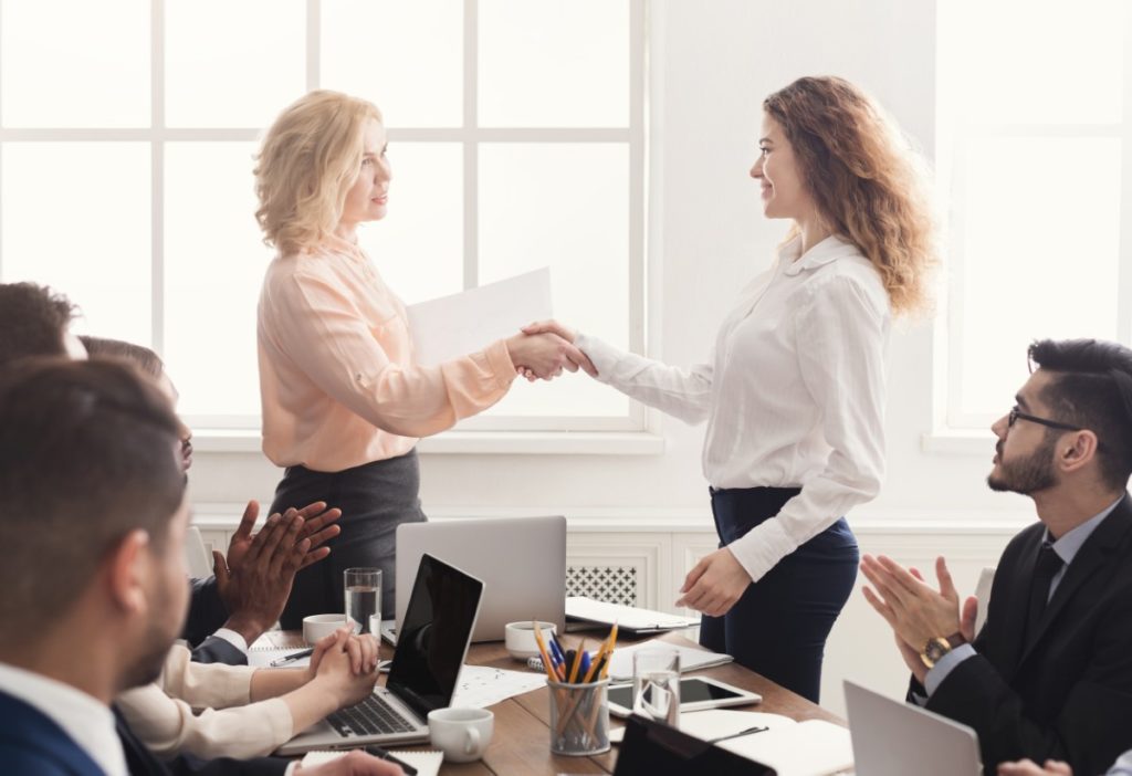 young woman admiring project manager leadership from her boss