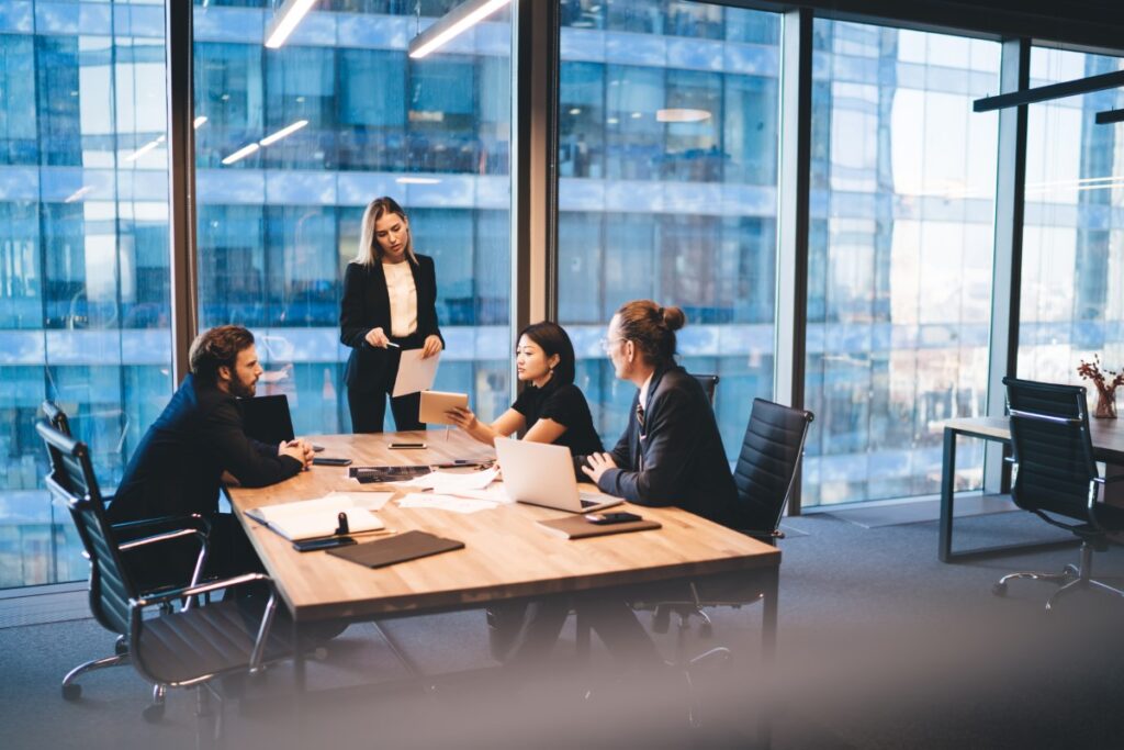 project management team working in open window office