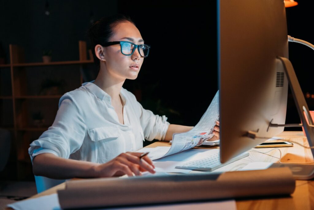 female working late at night in home on computer