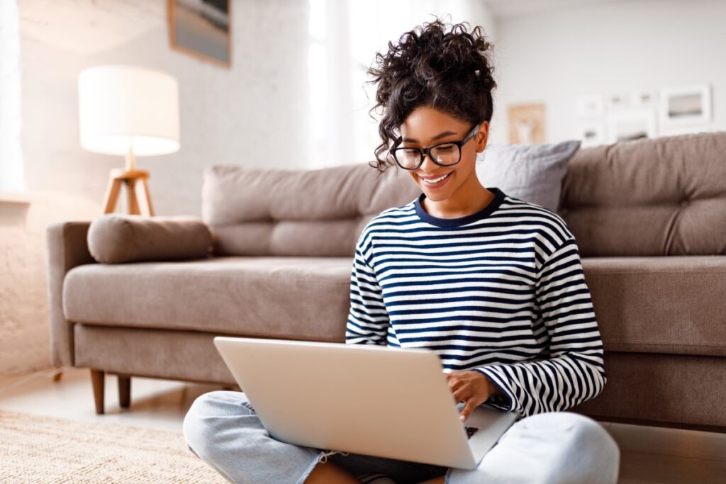 young woman working from home seated