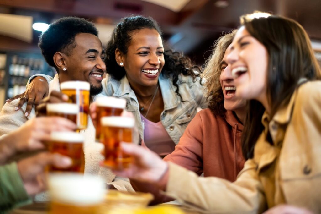 group of people cheersing their glasses