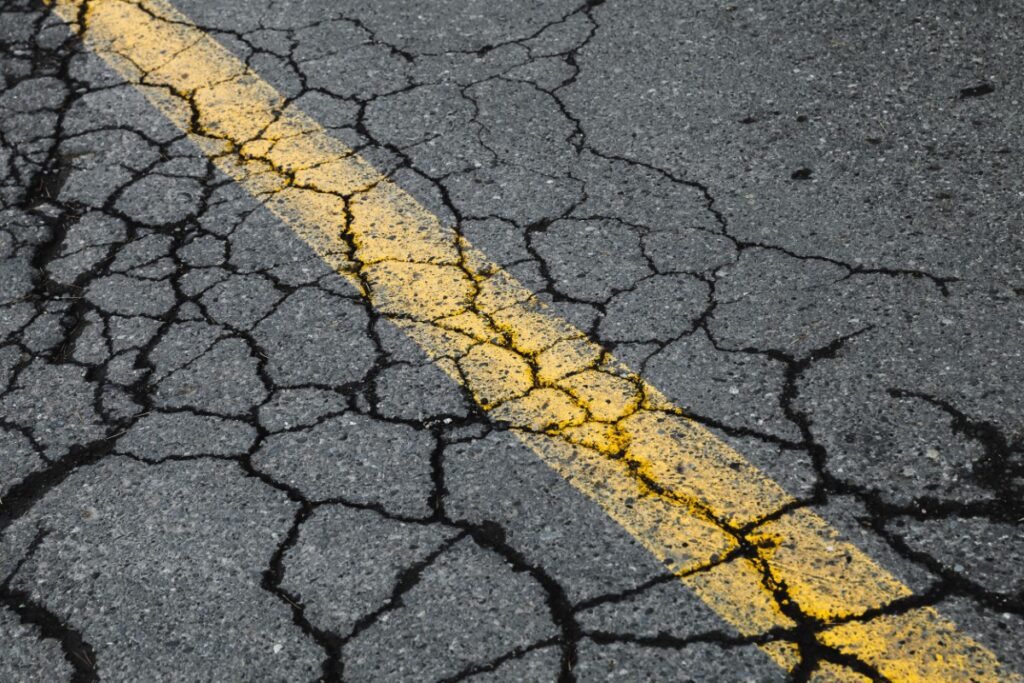 road with cracks in pavement