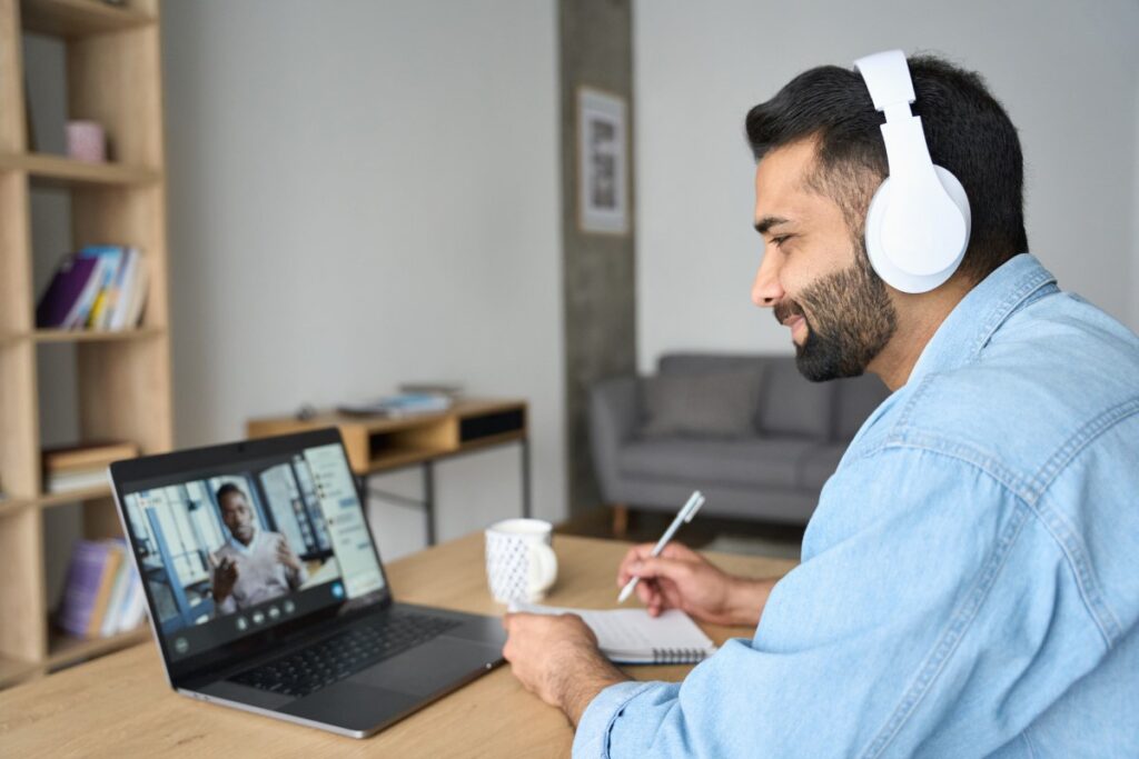 man on video meeting with remote employee