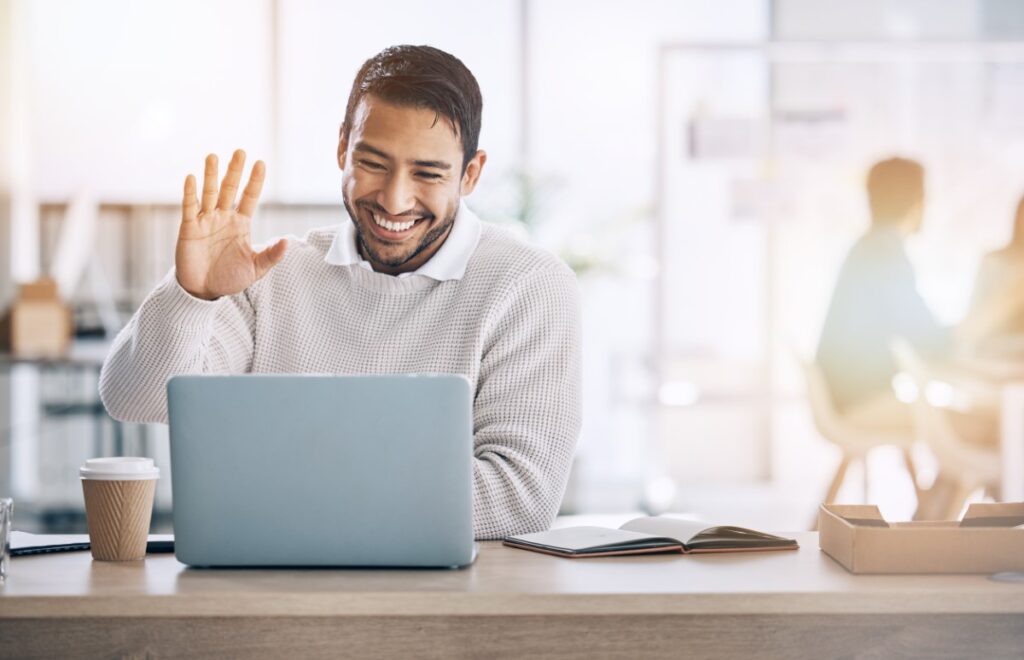 man not multitasking during a meeting