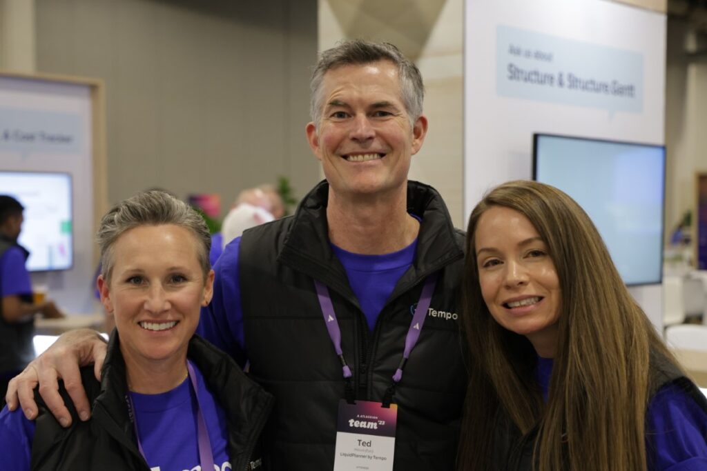 Gretchen Lohman, Ted Hawksford, and Jen Morrisey in front of the Tempo expo booth