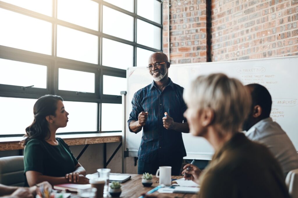 confident team leader coaching team through change